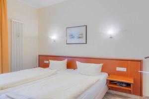 Ein Bett oder Betten in einem Zimmer der Unterkunft Villa Seestern Whg. 760