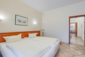 Ein Bett oder Betten in einem Zimmer der Unterkunft Villa Seestern Whg. 760