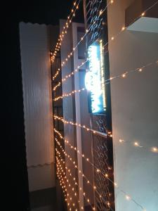 a wall with christmas lights on it at Wind Valley Homestay in Pelling