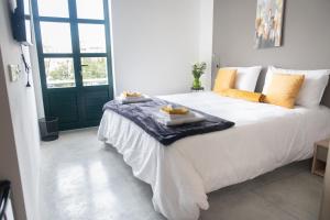Voodi või voodid majutusasutuse Privilege Suite toas