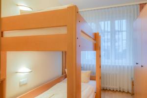 Ein Bett oder Betten in einem Zimmer der Unterkunft Villa Elfeld 2 Whg. 717