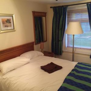 Postel nebo postele na pokoji v ubytování The Grafton Rooms