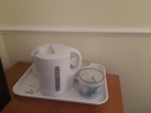 a white blender on a tray on a table at The Grafton Rooms in Northampton