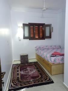 Ein Bett oder Betten in einem Zimmer der Unterkunft Nubian Queen Guest House