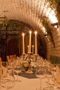 a long table with empty wine glasses on it at Hotel Rebschule in Freyburg +25 photos