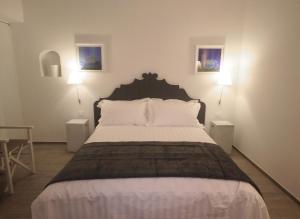 A bed or beds in a room at Ca' de Tobia