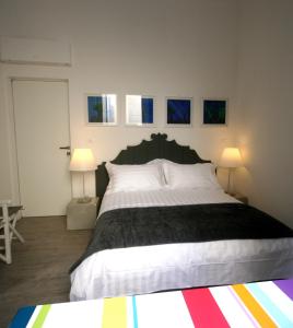 A bed or beds in a room at Ca' de Tobia