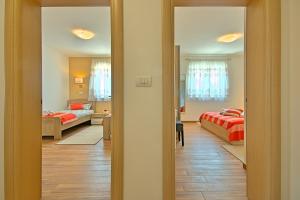 Postel nebo postele na pokoji v ubytování Villa Muskovic - Weingut Muskovic