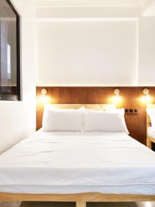 Letto o letti in una camera di NomadsMNL Airport Hostel