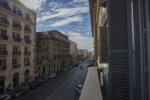 a view of a city street from a building at Colosseo Prestige Rooms in Rome