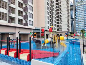 a pool with a water park with a playground at Bali Residences Homestay Melaka Town in Malacca