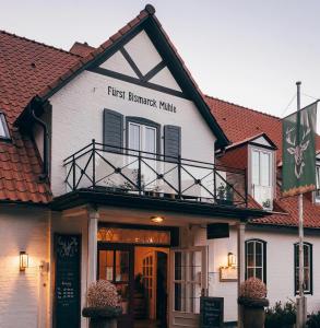 a building with a first breakfast maker sign on it at Fürst Bismarck Mühle in Aumühle