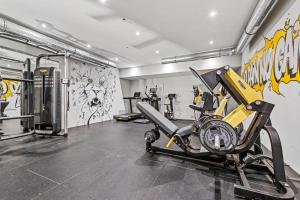 a gym with a bike and a treadmill at Karl und Anton Boutique Apartments in Vienna