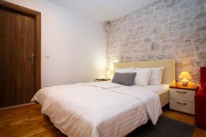 Posteľ alebo postele v izbe v ubytovaní Stone House Marino