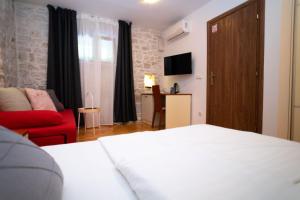 Posteľ alebo postele v izbe v ubytovaní Stone House Marino