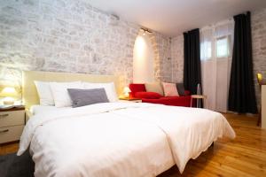 Posteľ alebo postele v izbe v ubytovaní Stone House Marino