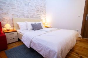 Posteľ alebo postele v izbe v ubytovaní Stone House Marino