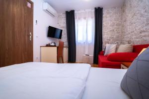 Posteľ alebo postele v izbe v ubytovaní Stone House Marino