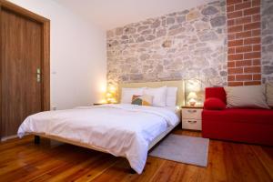 Posteľ alebo postele v izbe v ubytovaní Stone House Marino