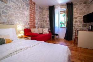 Posteľ alebo postele v izbe v ubytovaní Stone House Marino