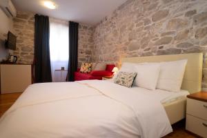 Posteľ alebo postele v izbe v ubytovaní Stone House Marino