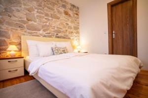 Posteľ alebo postele v izbe v ubytovaní Stone House Marino