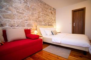 Posteľ alebo postele v izbe v ubytovaní Stone House Marino