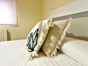 Postel nebo postele na pokoji v ubytování Housing León La Imprenta