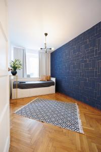 Posteľ alebo postele v izbe v ubytovaní Maison Brühl - Apartamenty przy Ogrodzie Saskim