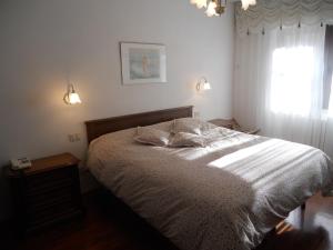A bed or beds in a room at Albergo Generale Cantore - Monte Amiata