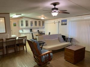 a living room with a couch and a table and a kitchen at Edgewater Getaway in Port Lavaca