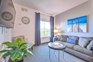 a living room with a couch and a table at Orlando Family Condo about 9 Mi to Magic Kingdom! in Orlando