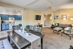 a living room with a dining table and a kitchen at Pet-Friendly Scottsdale Condo with Pool Access! in Scottsdale