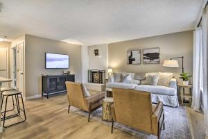 a living room with a couch and a tv at Lovely Vancouver Retreat with Home Gym! in Vancouver