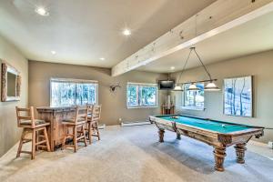 a room with a pool table and a bar at Spacious Fairplay Cabin with Mountain Views! in Fairplay