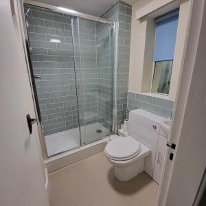 a bathroom with a toilet and a glass shower at Chapter House YORK in York +51 photos