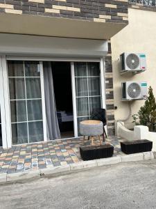 a chair sitting on the front porch of a house at La Casa Hotel Yerevan in Yerevan