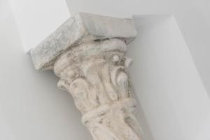 a statue of a hand holding up a cross at Amalfi Ammorè in Amalfi