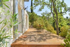 a wooden walkway leading to a house at Cottage Sylvie à 25 minutes Cassis in Roquevaire