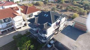 an overhead view of a large white house with a roof at Art Suites Mesologgi in Missolonghi +31 photos