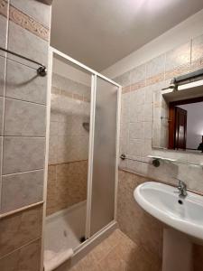a bathroom with a shower and a sink at Alius and Freerome Hotel in Rome