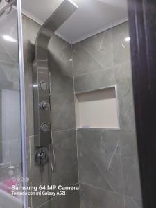 a shower with a glass door in a bathroom at Casa Bella Vista in Buenavista