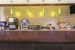 a counter in a restaurant with a coffee shop at La Quinta by Wyndham Tampa Bay Area-Tampa South in Tampa