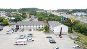 an aerial view of a parking lot in front of a building at Super 8 by Wyndham Columbia Clark Lane in Columbia