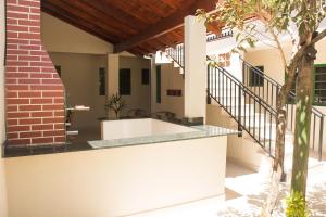 an external view of a house with a staircase at Apto com churrasq em Monte Castelo-Campo Grande MS in Campo Grande