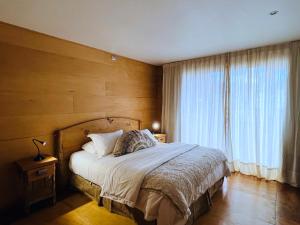 Postel nebo postele na pokoji v ubytování Palafito 1326 Hotel Boutique Chiloé