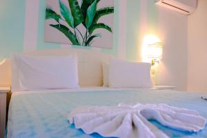 Letto o letti in una camera di Ocean Point Beach Resort & Spa Adults Only