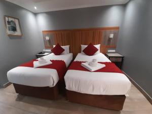 Postel nebo postele na pokoji v ubytování Starlight Inn