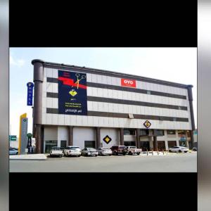 a large building with cars parked in front of it at فندق تايا - Taya Hotel in Sūq al Aḩad