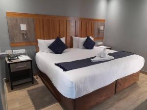 Postel nebo postele na pokoji v ubytování Starlight Inn